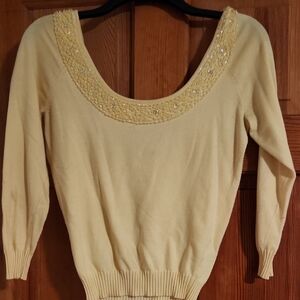 Elegant Cream Sweater with Embellished Neckline